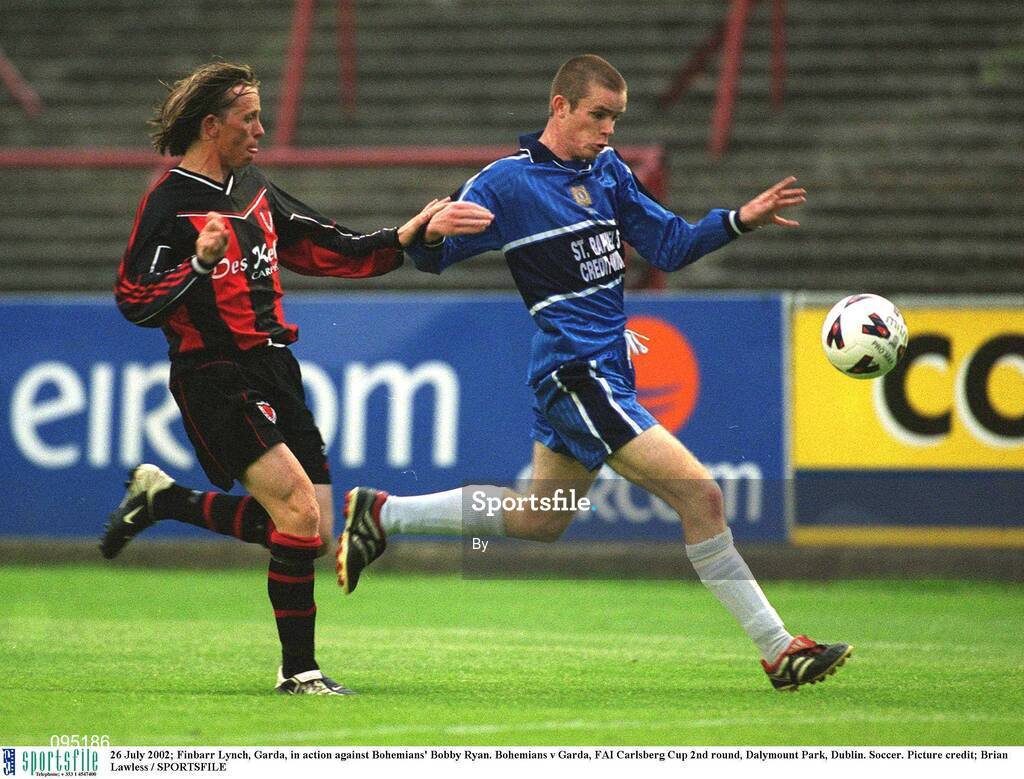 26 July 2002; Finbarr Lynch, Garda, in action against Bohemians' Bobby Ryan. Bohemians v Garda, FAI Carlsberg Cup 2nd round, Dalymount Park, Dublin. Soccer. Picture credit; Brian Lawless / SPORTSFILE