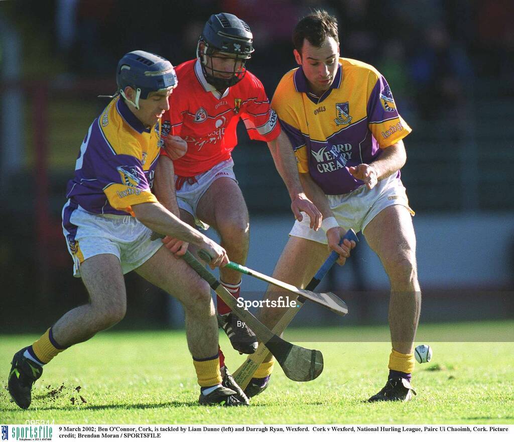 9 March 2002; Ben O'Connor, Cork, is tackled by Liam Dunne (left) and Darragh Ryan, Wexford.  Cork v Wexford, National Hurling League, Pairc Ui Chaoimh, Cork. Picture credit; Brendan Moran / SPORTSFILE