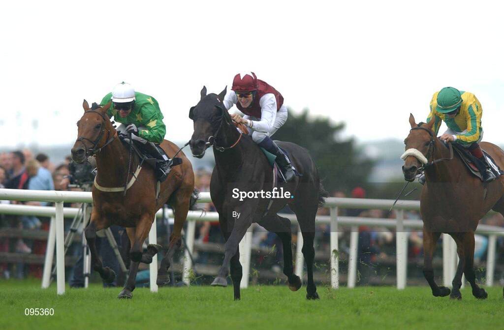 31 July 2002; Lowlander, with Fran Berry up, center, wins the HP Software Publishing Services Handicap from Dr Knock with Seamus Heffernan, left, and Near Dunleer, Wayne Lordan. Galway Races, Co. Galway. Horse Racing. Picture credit; Matt Browne / SPORTSFILE *EDI*