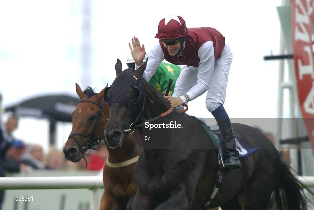 31 July 2002; Fran Berry on Lowlander celebrates after winning the HP Software Publishing Services Handicap from Dr Knock with Seamus Heffernan. Galway Races, Ballybrit, Co. Galway. Horse Racing. Picture credit; Matt Browne / SPORTSFILE *EDI*