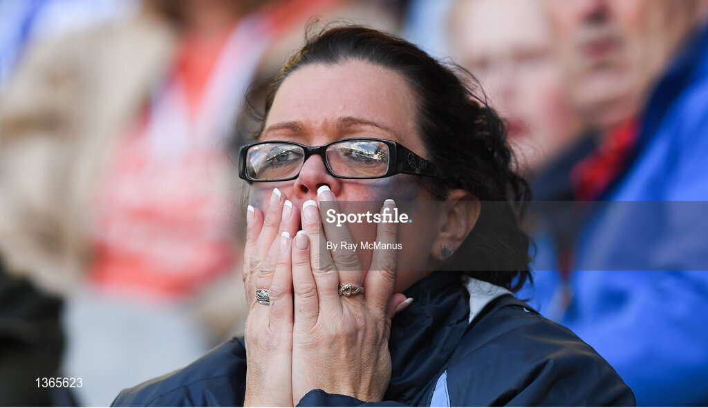 5 August 2017; A Dublin supporter, in the Cusack Stand, watches the second half of the GAA Football All-Ireland Senior Championship Quarter-Final match between Dublin and Monaghan at Croke Park in Dublin. Photo by Ray McManus/Sportsfile