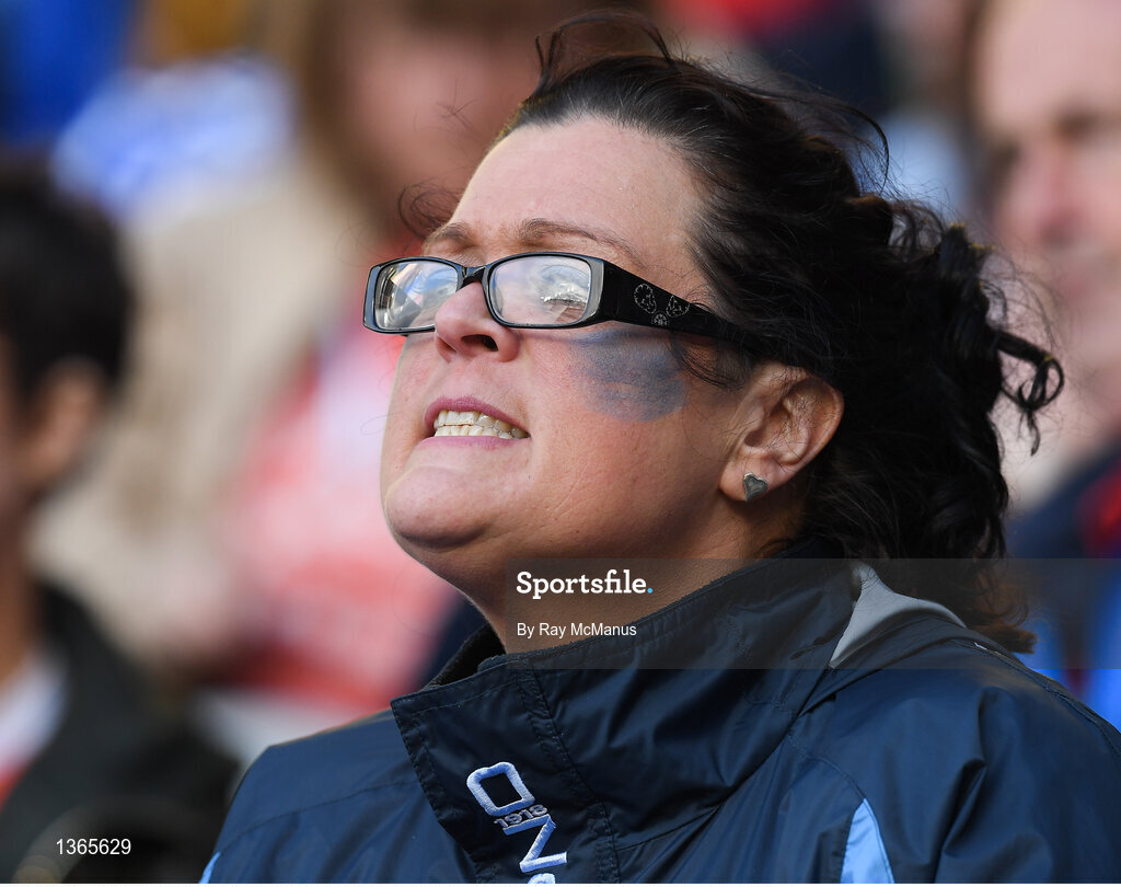 5 August 2017; A Dublin supporter, in the Cusack Stand, watches the second half of the GAA Football All-Ireland Senior Championship Quarter-Final match between Dublin and Monaghan at Croke Park in Dublin. Photo by Ray McManus/Sportsfile