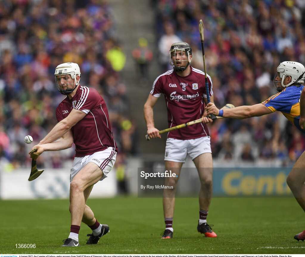 6 August 2017; Joe Canning of Galway, under pressure from Niall O'Meara of Tipperary, hits over what proved to be the winning point in the last minute of the Hurling All-Ireland Senior Championship Semi-Final match between Galway and Tipperary at Croke Park in Dublin. Photo by Ray McManus/Sportsfile