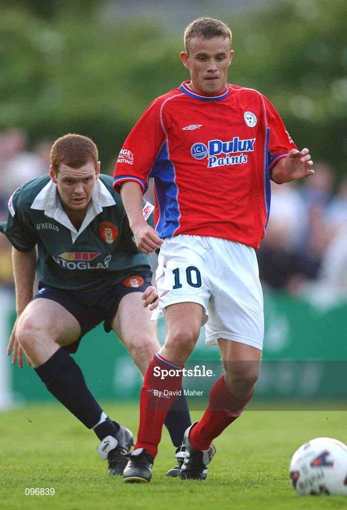 16 August 2002; Mark Roberts of Shelbourne in action against Colm Foley of St Patrick's Athletic during the eircom League Premier Division match between St Patrick's Athletic and Shelbourne at Richmond Park in Dublin. Photo by David Maher/Sportsfile