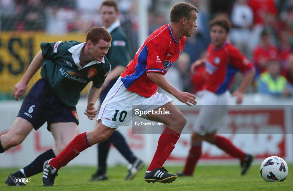 16 August 2002; Mark Roberts of Shelbourne in action against Colm Foley of St Patrick's Athletic during the eircom League Premier Division match between St Patrick's Athletic and Shelbourne at Richmond Park in Dublin. Photo by David Maher/Sportsfile
