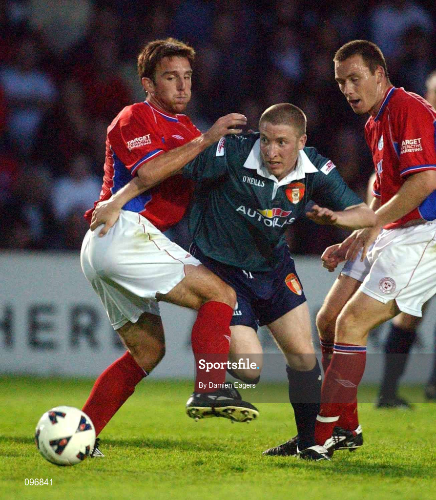 16 August 2002; Philip Hughes of St Patrick's Athletic in action against Stuart Byrne of Shelbourne during the eircom League Premier Division match between St Patrick's Athletic and Shelbourne at Richmond Park in Dublin. Photo by Damien Eagers/Sportsfile
