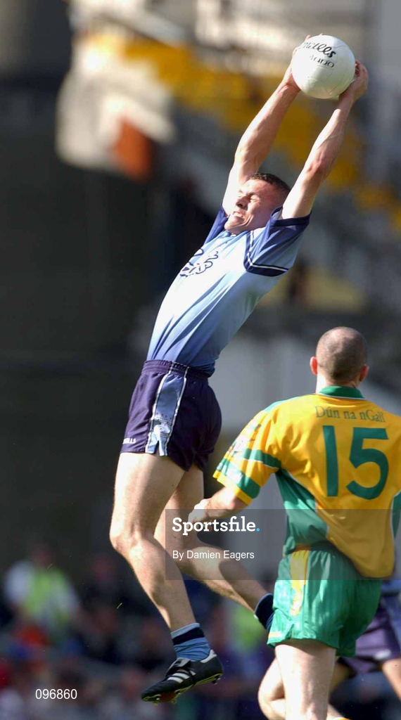 17 August 2002; Ciarán Whelan of Dublin gathers possession as Paul McGonigle of Donegal looks on during the Bank of Ireland All-Ireland Senior Football Championship Quarter-Final Replay match between Dublin and Donegal at Croke Park in Dublin. Photo by Damien Eagers/Sportsfile
