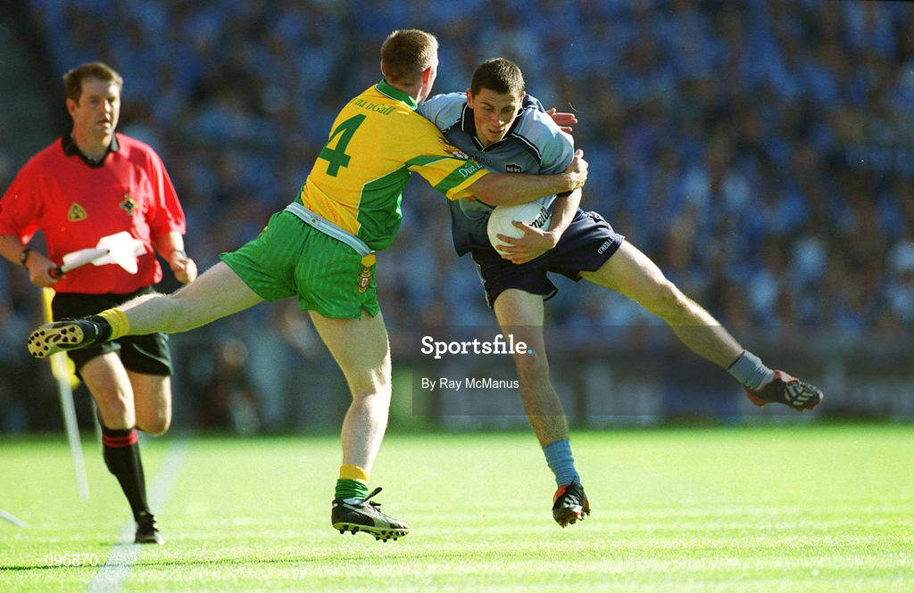 17 August 2002; Alan Brogan of Dublin in action against Noel McGinley of Donegal, as linesman Michael Monahan looks on, during the Bank of Ireland All-Ireland Senior Football Championship Quarter-Final Replay match between Dublin and Donegal at Croke Park in Dublin. Photo by Ray McManus/Sportsfile
