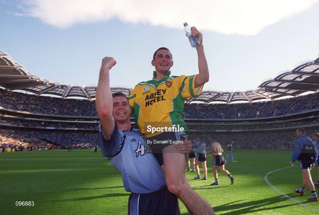 17 August 2002; Dublin's Alan Brogan is lifted by team-mate Darren Magee as they celebrate in front of Hill 16 after the Bank of Ireland All-Ireland Senior Football Championship Quarter-Final Replay match between Dublin and Donegal at Croke Park in Dublin. Photo by Damien Eagers/Sportsfile