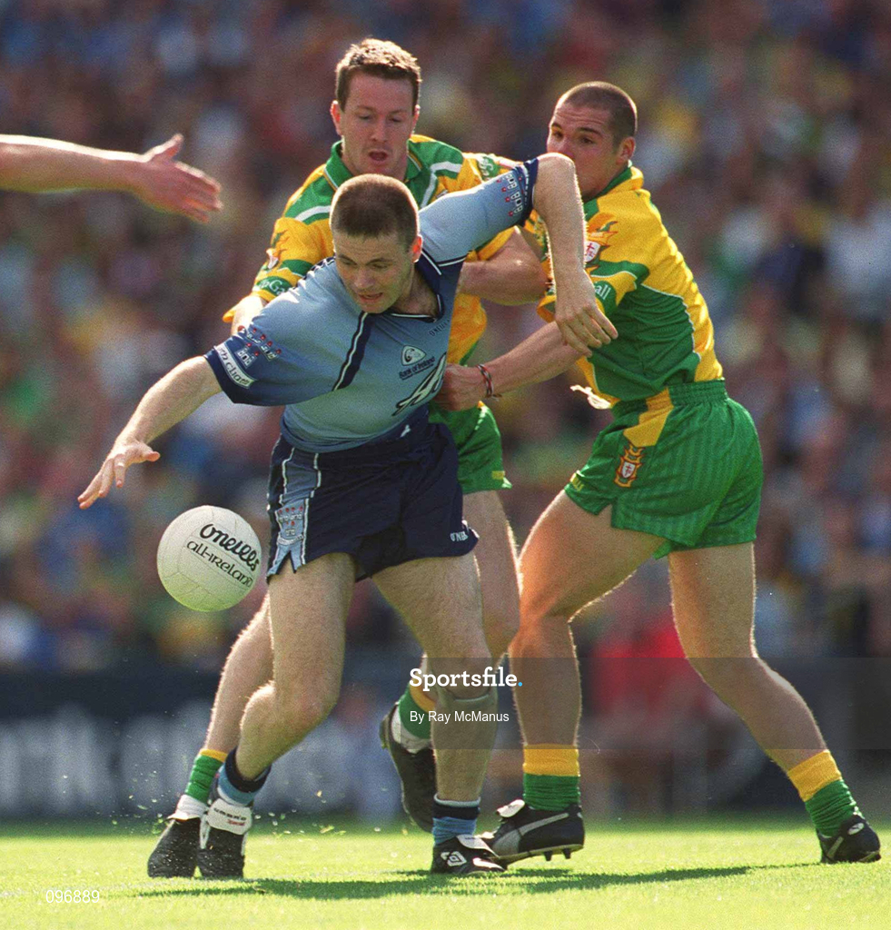 17 August 2002; Dessie Farrell of Dublin is tackled by Raymond Sweeney and Kevin Cassidy, right, of Donegal during the Bank of Ireland All-Ireland Senior Football Championship Quarter-Final Replay match between Dublin and Donegal at Croke Park in Dublin. Photo by Ray McManus/Sportsfile