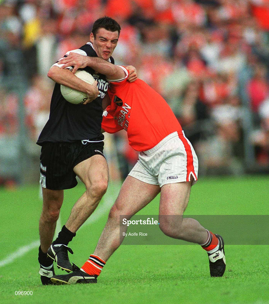18 August 2002; Dara McGarty of Sligo in action against John Donaldson of Armagh during the Bank of Ireland All-Ireland Senior Football Championship Quarter-Final Replay match between Armagh and Sligo at Páirc Tailteann in Navan, Meath. Photo by Aoife Rice/Sportsfile