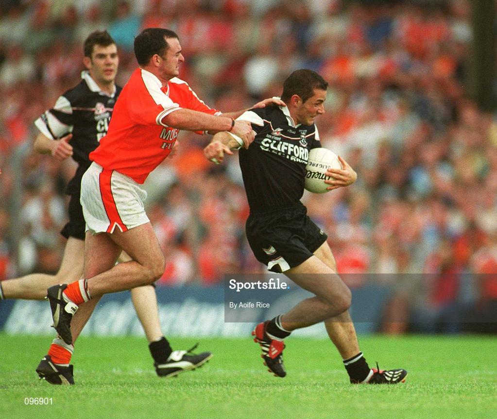 18 August 2002; Eamonn O'Hara of Sligo in action against Aidan O'Rourke of Armagh during the Bank of Ireland All-Ireland Senior Football Championship Quarter-Final Replay match between Armagh and Sligo at Páirc Tailteann in Navan, Meath. Photo by Aoife Rice/Sportsfile