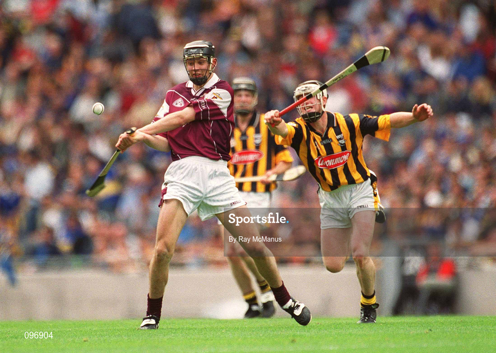 18 August 2002; Iarla Tannian of Galway gets his shot away under pressure from Padraig Holden of Kilkenny during the All-Ireland Minor Hurling Championship Semi-Final match between Kilkenny and Galway at Croke Park in Dublin. Photo by Ray McManus/Sportsfile