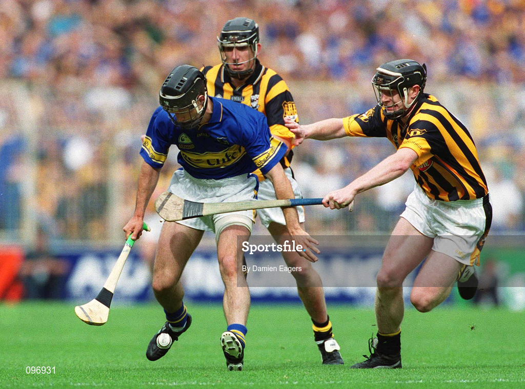 18 August 2002; Thomas Dunne of Tipperary in action against Peter Barry, right, and Derek Lyng of Kilkenny during the Guinness All-Ireland Senior Hurling Championship Semi-Final match between Kilkenny and Tipperary at Croke Park in Dublin. Photo by Damien Eagers/Sportsfile