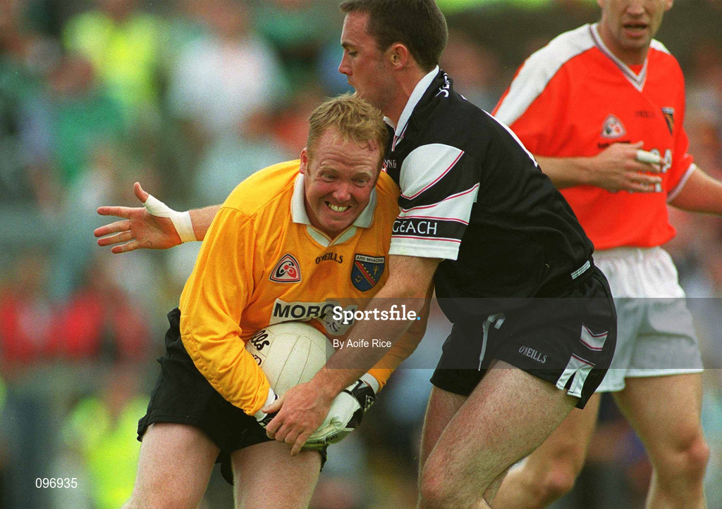 18 August 2002; Armagh goalkeeper Brendan Tierney is tackled by Dessie Sloyan of Sligo during the Bank of Ireland All-Ireland Senior Football Championship Quarter-Final Replay match between Armagh and Sligo at Páirc Tailteann in Navan, Meath. Photo by Aoife Rice/Sportsfile