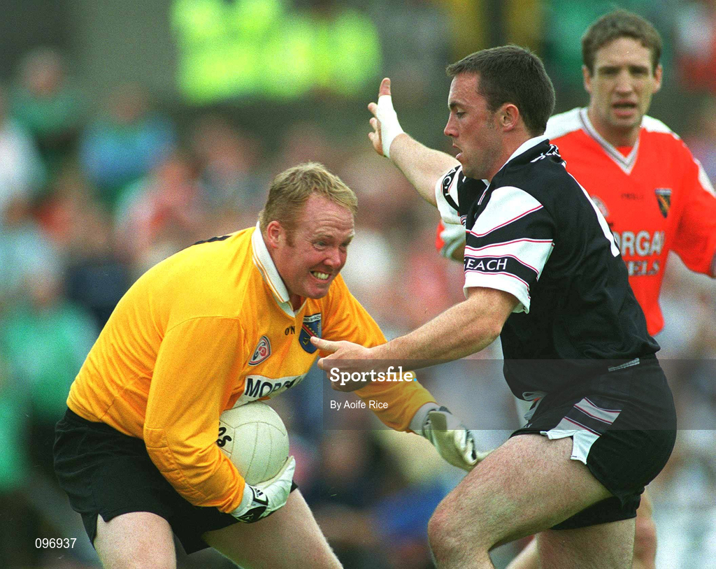 18 August 2002; Armagh goalkeeper Brendan Tierney is tackled by Dessie Sloyan of Sligo during the Bank of Ireland All-Ireland Senior Football Championship Quarter-Final Replay match between Armagh and Sligo at Páirc Tailteann in Navan, Meath. Photo by Aoife Rice/Sportsfile
