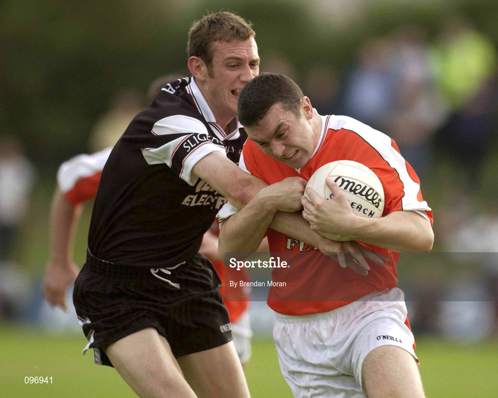 18 August 2002; Oisín McConville of Armagh in action against Noel McGuire of Sligo during the Bank of Ireland All-Ireland Senior Football Championship Quarter-Final Replay match between Armagh and Sligo at Páirc Tailteann in Navan, Meath. Photo by Brendan Moran/Sportsfile