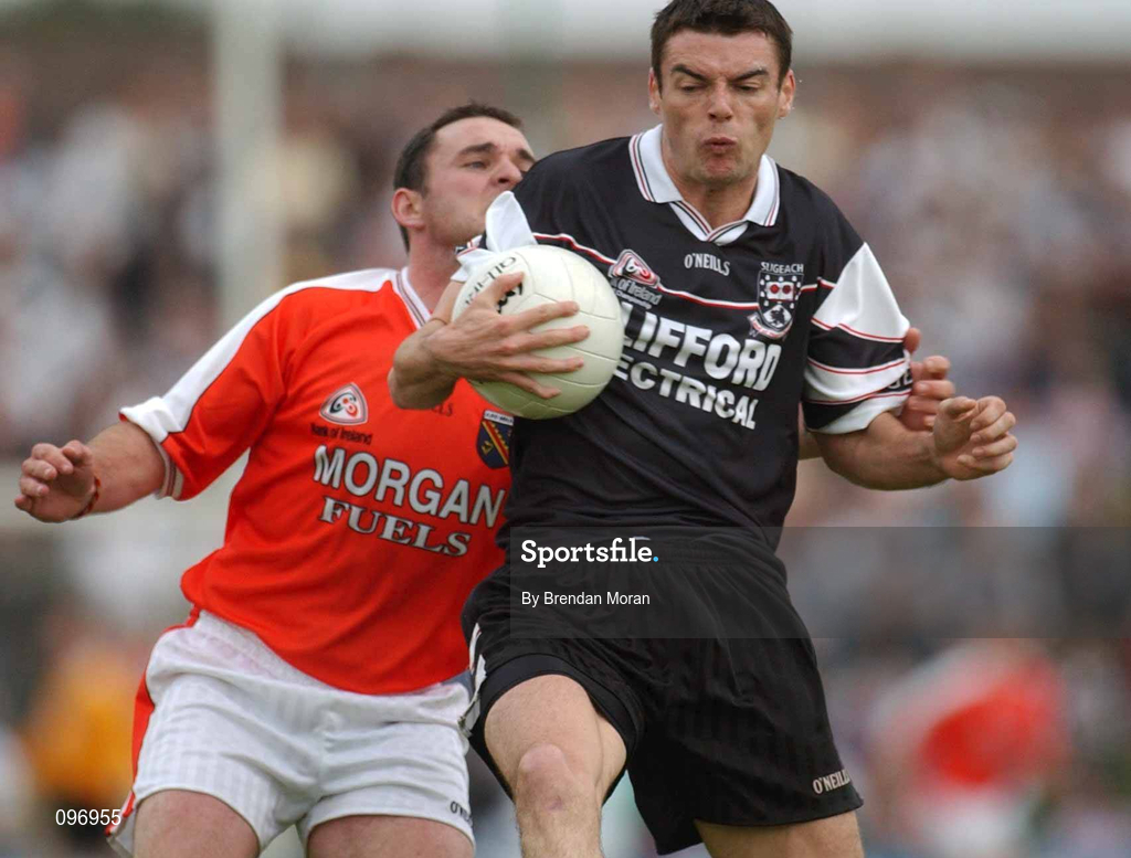 18 August 2002; Dara McGarty of Sligo in action against Aidan O'Rourke of Armagh during the Bank of Ireland All-Ireland Senior Football Championship Quarter-Final Replay match between Armagh and Sligo at Páirc Tailteann in Navan, Meath. Photo by Brendan Moran/Sportsfile