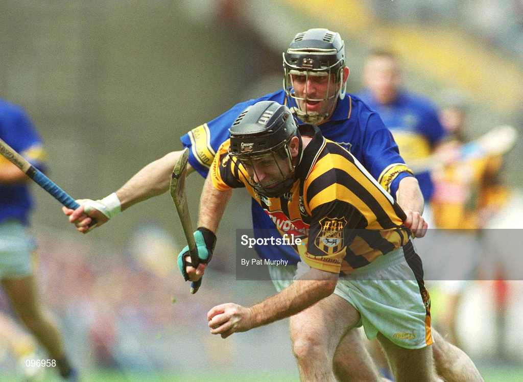 18 August 2002; DJ Carey of Kilkenny is tackled by Thomas Costello of Tipperary during the Guinness All-Ireland Senior Hurling Championship Semi-Final match between Kilkenny and Tipperary at Croke Park in Dublin. Photo by Pat Murphy/Sportsfile