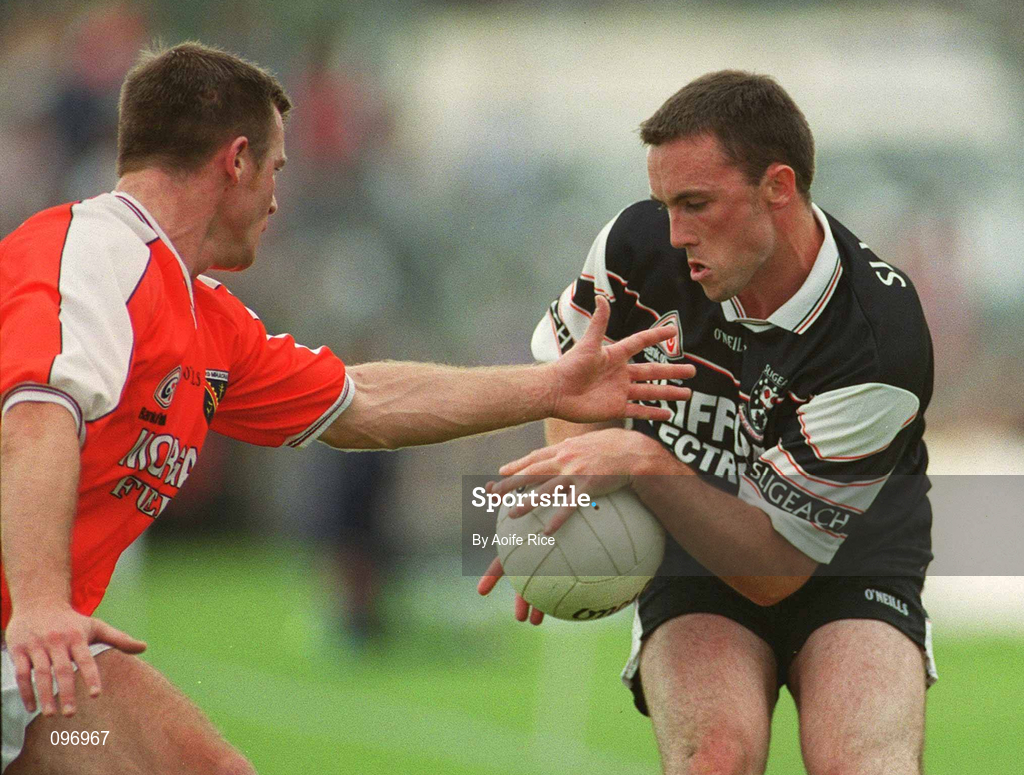 18 August 2002; Dessie Sloyan of Sligo in action against Justin McNullty of Armagh during the Bank of Ireland All-Ireland Senior Football Championship Quarter-Final Replay match between Armagh and Sligo at Páirc Tailteann in Navan, Meath. Photo by Aoife Rice/Sportsfile