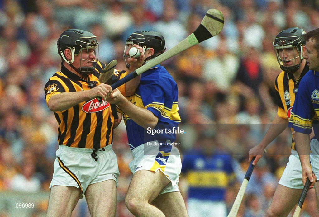18 August 2002; Noel Hickey of Kilkenny is tackled by Eoin Kelly of Tipperary during the Guinness All-Ireland Senior Hurling Championship Semi-Final match between Kilkenny and Tipperary at Croke Park in Dublin. Photo by Brian Lawless/Sportsfile