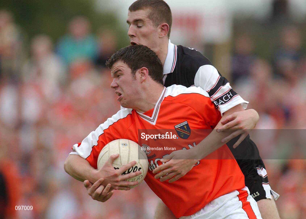 18 August 2002; Ronan Clarke of Armagh in action against Patrick Naughton of Sligo during the Bank of Ireland All-Ireland Senior Football Championship Quarter-Final Replay match between Armagh and Sligo at Páirc Tailteann in Navan, Meath. Photo by Brendan Moran/Sportsfile