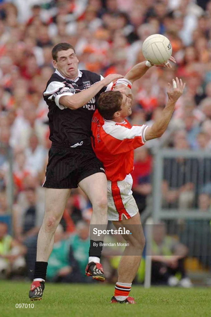 18 August 2002; Kieran McGeeney of Armagh in action against John McPartland of Sligo during the Bank of Ireland All-Ireland Senior Football Championship Quarter-Final Replay match between Armagh and Sligo at Páirc Tailteann in Navan, Meath. Photo by Brendan Moran/Sportsfile