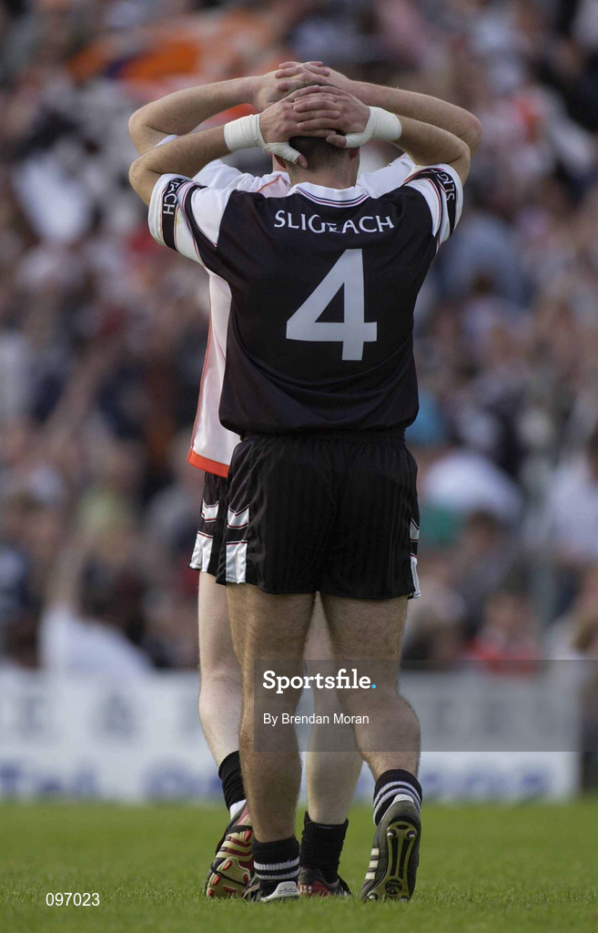 18 August 2002; Dejected Sligo players Brendan Phillips, 4, and John McPartland after the Bank of Ireland All-Ireland Senior Football Championship Quarter-Final Replay match between Armagh and Sligo at Páirc Tailteann in Navan, Meath. Photo by Brendan Moran/Sportsfile