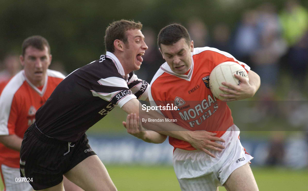 18 August 2002; Oisín McConville of Armagh in action against Noel McGuire of Sligo during the Bank of Ireland All-Ireland Senior Football Championship Quarter-Final Replay match between Armagh and Sligo at Páirc Tailteann in Navan, Meath. Photo by Brendan Moran/Sportsfile