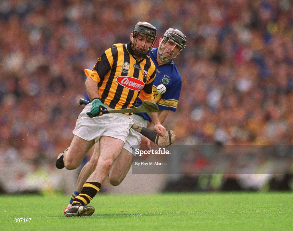 18 August 2002; DJ Carey of Kilkenny races away from Thomas Costello of Tipperary during the Guinness All-Ireland Senior Hurling Championship Semi-Final match between Kilkenny and Tipperary at Croke Park in Dublin. Photo by Ray McManus/Sportsfile