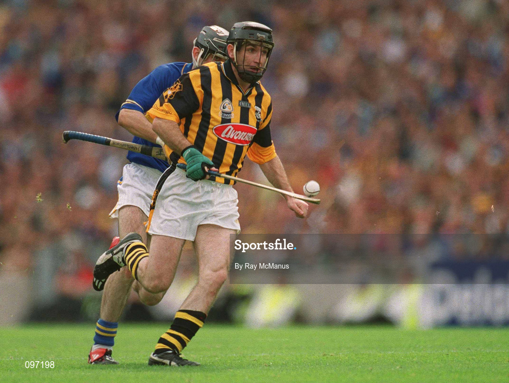18 August 2002; DJ Carey of Kilkenny races away from Thomas Costello of Tipperary during the Guinness All-Ireland Senior Hurling Championship Semi-Final match between Kilkenny and Tipperary at Croke Park in Dublin. Photo by Ray McManus/Sportsfile