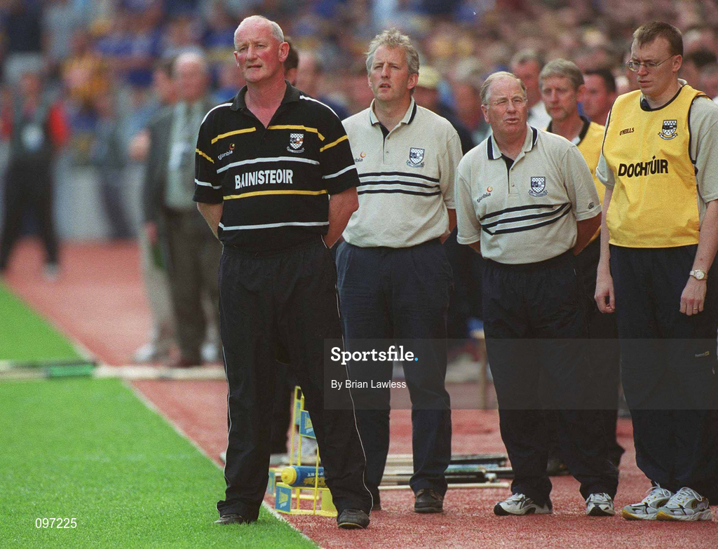 18 August 2002; Kilkenny manager Brian Cody, left, with second from left, Pat Dunphy, Secretary of the Kilkenny County Board, Noel Skehan, Kilkenny selector, and Kilkenny team doctor Dr Tadhg Crowley as they all stand for the National Anthem prior to the Guinness All-Ireland Senior Hurling Championship Semi-Final match between Kilkenny and Tipperary at Croke Park in Dublin. Photo by Brian Lawless/Sportsfile