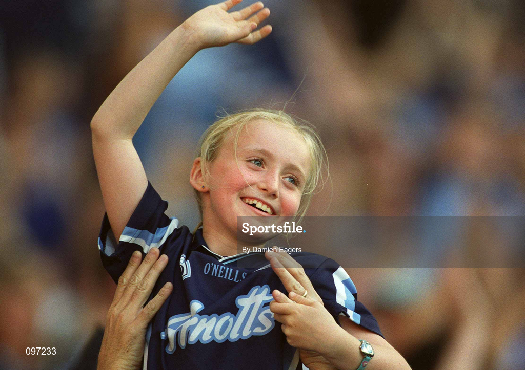 17 August 2002; A young Dublin fan is lifted high above the crowd as she cheers her side on during the Bank of Ireland All-Ireland Senior Football Championship Quarter-Final Replay match between Dublin and Donegal at Croke Park in Dublin. Photo by Damien Eagers/Sportsfile