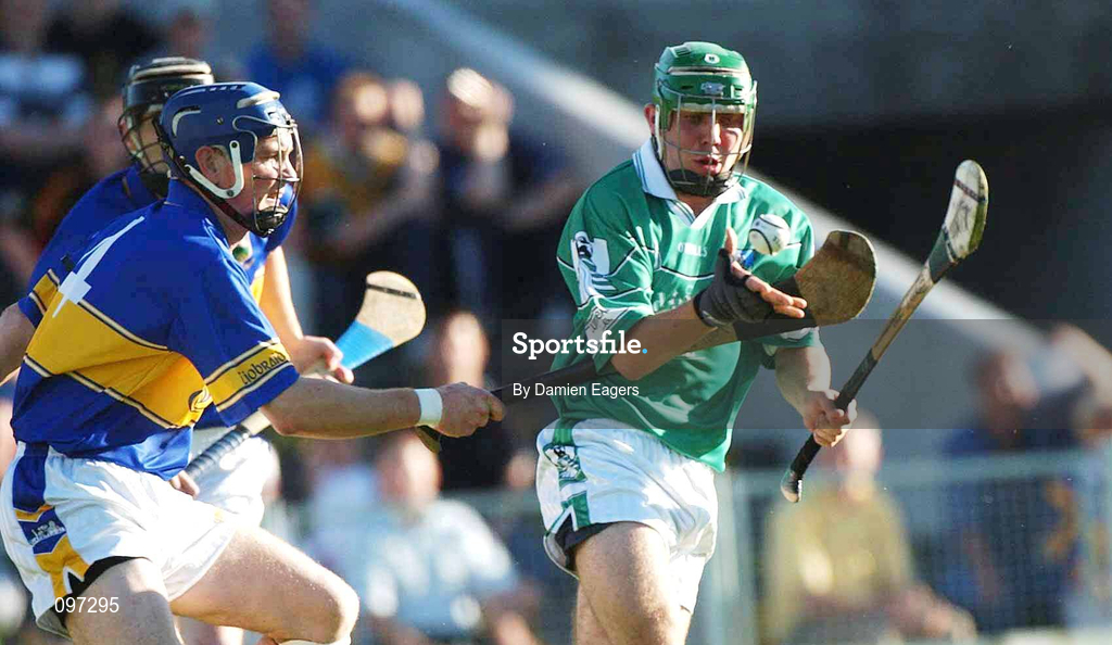 21 August 2002; Patrick Kirby of Limerick in action against Martin Maher of Tipperary during the Munster U21 Hurling Championship Final Replay match between Tipperary and Limerick at Semple Stadium in Thurles, Tipperary. Photo by Damien Eagers/Sportsfile