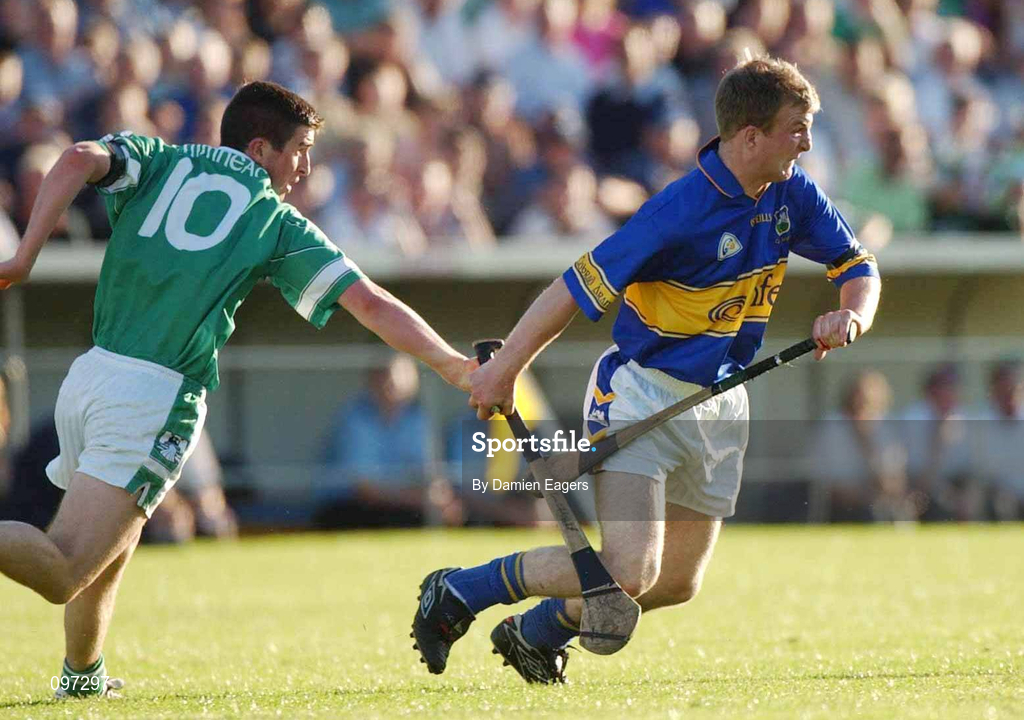 21 August 2002; Dermot Gleeson of Tipperary in action against Conor Fitzgerald of Limerick during the Munster U21 Hurling Championship Final Replay match between Tipperary and Limerick at Semple Stadium in Thurles, Tipperary. Photo by Damien Eagers/Sportsfile