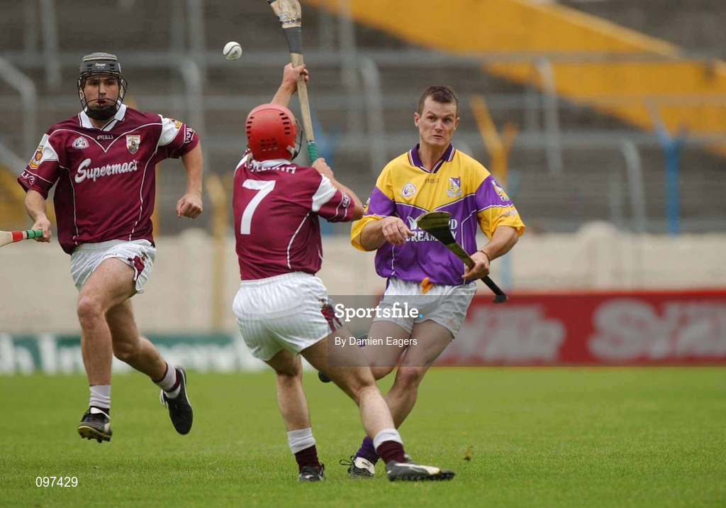 24 August 2002; Darren Stamp of Wexford in action against Michael J Quinn of Galway, 7, during the All-Ireland U21 Hurling Championship Semi-Final match between Galway and Wexford at Semple Stadium in Thurles, Tipperary. Photo by Damien Eagers/Sportsfile