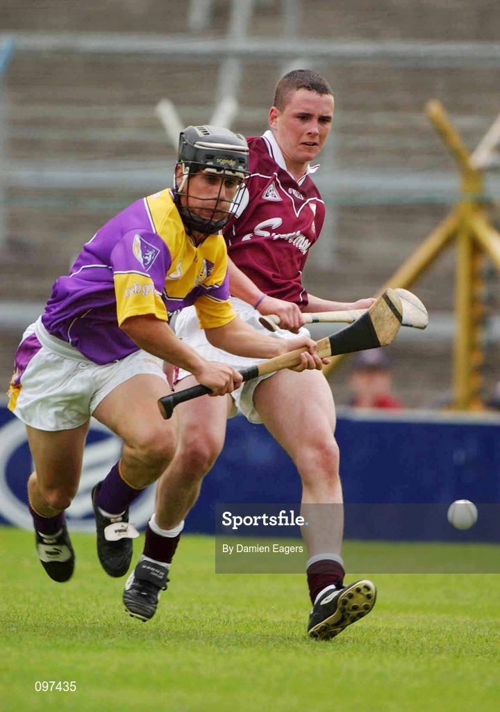 24 August 2002; Tomas Hawkins of Wexford in action against Kevin Brady of Galway during the All-Ireland U21 Hurling Championship Semi-Final match between Galway and Wexford at Semple Stadium in Thurles, Tipperary. Photo by Damien Eagers/Sportsfile
