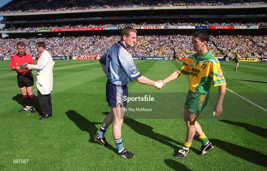 17 August 2002; Dublin captain Coman Goggins shakes hands with Donegal captain Michael Hegarty as referee Pat McEnaney Gives instruction to one of his umpires prior to the Bank of Ireland All-Ireland Senior Football Championship Quarter-Final Replay match between Dublin and Donegal at Croke Park in Dublin. Photo by Ray McManus/Sportsfile