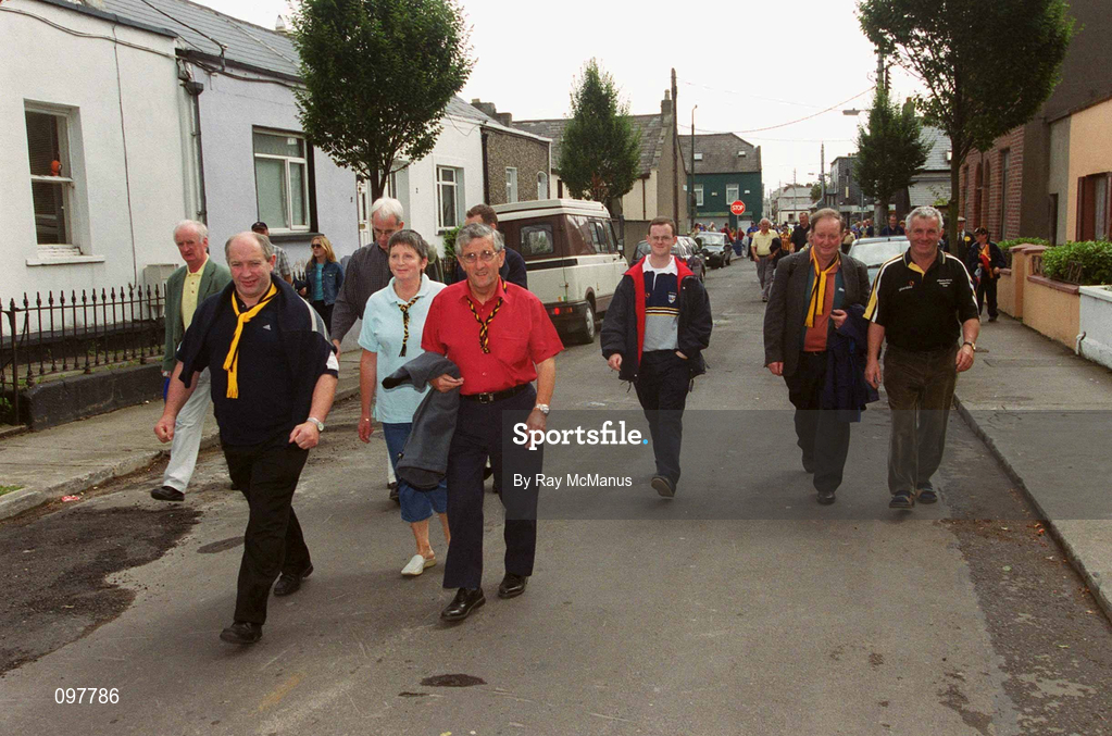 18 August 2002; Supporters make their way to Croke Park through a residental area ahead of the Guinness All-Ireland Senior Hurling Championship Semi-Final match between Kilkenny and Tipperary at Croke Park in Dublin. Photo by Ray McManus/Sportsfile