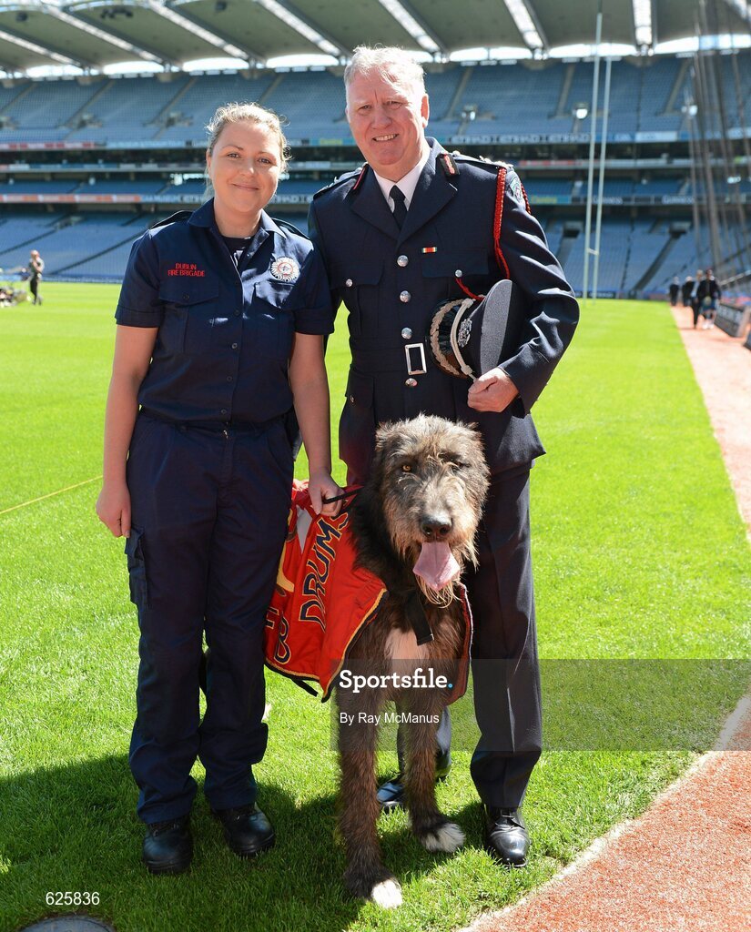 29 May 2012; In attendance at a Dublin Fire Brigade 150 year celebration photocall are Sinéad Peers, A watch, Tara Street, and Chief Fire Officer Stephen Brady and the band mascot Paddy. Dublin Fire Brigade and many of their friends from Fire and Police departments across the United States have travelled to Dublin to perform with them throughout the weekend, culminating in a performance at Croke Park for the Leinster GAA football senior championship 2012 Quarter-Finals. Croke Park, Dublin. Picture credit: Ray McManus / SPORTSFILE
