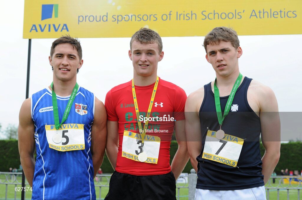 2 June 2012; Gold medal winner Marcus Lawlor, centre, from CBS Carlow, with second place Greg O'Shea, left, from Crescent College, Co. Limerick, and third place Paddy Colhoun, right, from, Methodist College, Belfast, Co. Antrim, after the Senior Boys 100m at the Aviva All Ireland Schools’ Track and Field Championships 2012. Tullamore Harriers AC, Tullamore, Co. Offaly. Picture credit: Matt Browne / SPORTSFILE