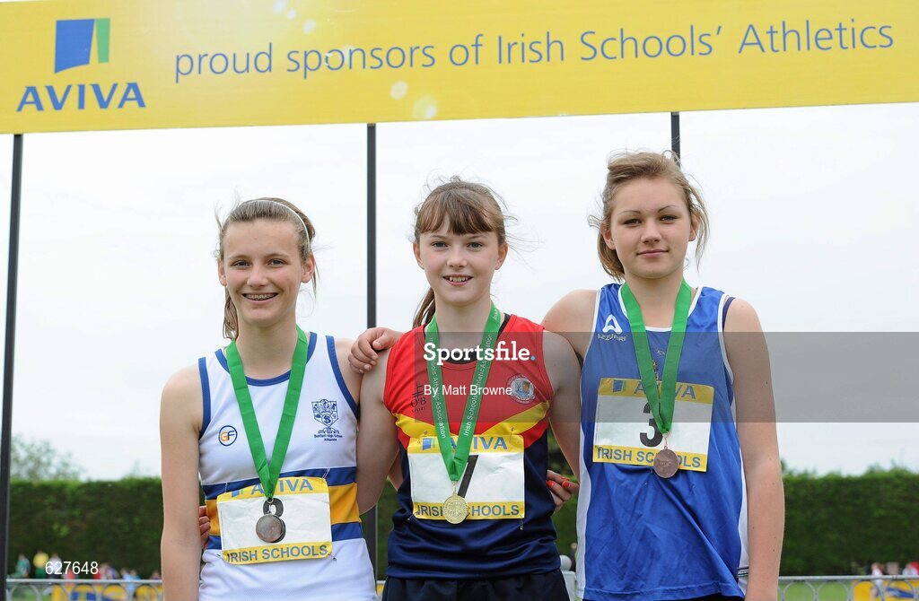 2 June 2012; Gold medal winner Lydia Mills, centre, from Ballyclare High School, Co. Antrim, with second place Jessice McMaster, left, from Belfast High School, Co. Antrim, and third place Kristina Sadovala, right, from, Tullamore College, Co. Offaly, after the Junior Girls Triple Jump at the Aviva All Ireland Schools’ Track and Field Championships 2012. Tullamore Harriers AC, Tullamore, Co. Offaly. Picture credit: Matt Browne / SPORTSFILE