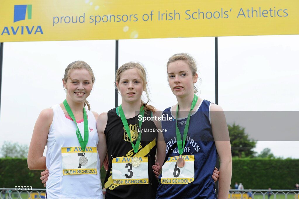 2 June 2012; Gold medal winner Siofra Clerigh Buttner, centre, from Coláiste Íosagáin, Dublin, with second place Aislinn Crossey, left, from Sacred Heart Newry, Co. Down, and third place Ella Davis, right, from, Victoria College Belfast, Co. Antrim, after the Intermediate Girls 800m at the Aviva All Ireland Schools’ Track and Field Championships 2012. Tullamore Harriers AC, Tullamore, Co. Offaly. Picture credit: Matt Browne / SPORTSFILE
