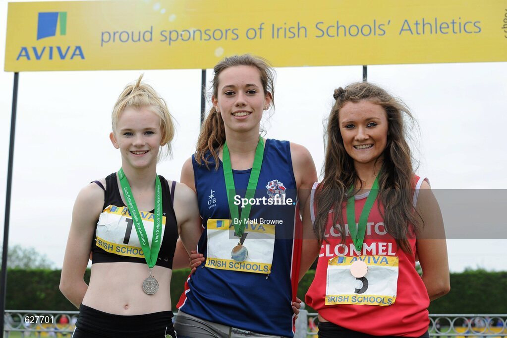 2 June 2012; Gold medal winner Roseanna McGuckian, centre, from Ballymena Academy, Co. Antrim, with second place Laura Ann Costello, left, from Dunmore CS, Co. Galway, and third place Phoebe Murphy, right, from, Loreto College, Clonmel, Co. Tipperary, after the Junior Girls 200m at the Aviva All Ireland Schools’ Track and Field Championships 2012. Tullamore Harriers AC, Tullamore, Co. Offaly. Picture credit: Matt Browne / SPORTSFILE