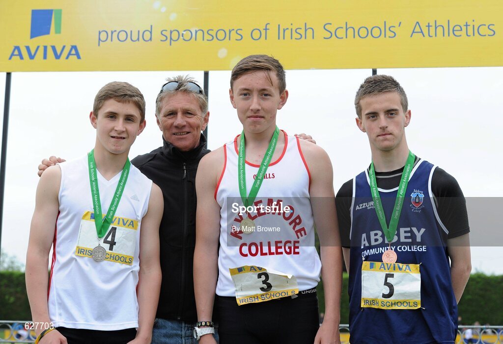 2 June 2012; Gold medal winner Sean Lawlor, centre, from Kylemore College, Dublin, with second place Eoin Doherty, left, from Drimnagh Castle, Dublin, third place Patrick O'Neill, right, from Abbey CC, Waterford, and Senator Eamonn Coghlan, after the Junior Boys 200m at the Aviva All Ireland Schools’ Track and Field Championships 2012. Tullamore Harriers AC, Tullamore, Co. Offaly. Picture credit: Matt Browne / SPORTSFILE