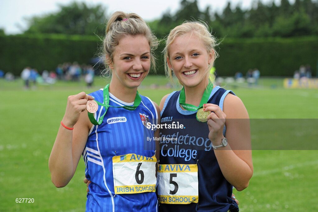 2 June 2012; Gold medal winner Sarah Lavin, right, from Castletroy College, Co. Limerick, with third place Lily Ann O'Hora, from, Cresent Community College, Co. Limerick, after the Senior Girls 100m Hurdles at the Aviva All Ireland Schools’ Track and Field Championships 2012. Tullamore Harriers AC, Tullamore, Co. Offaly. Picture credit: Matt Browne / SPORTSFILE