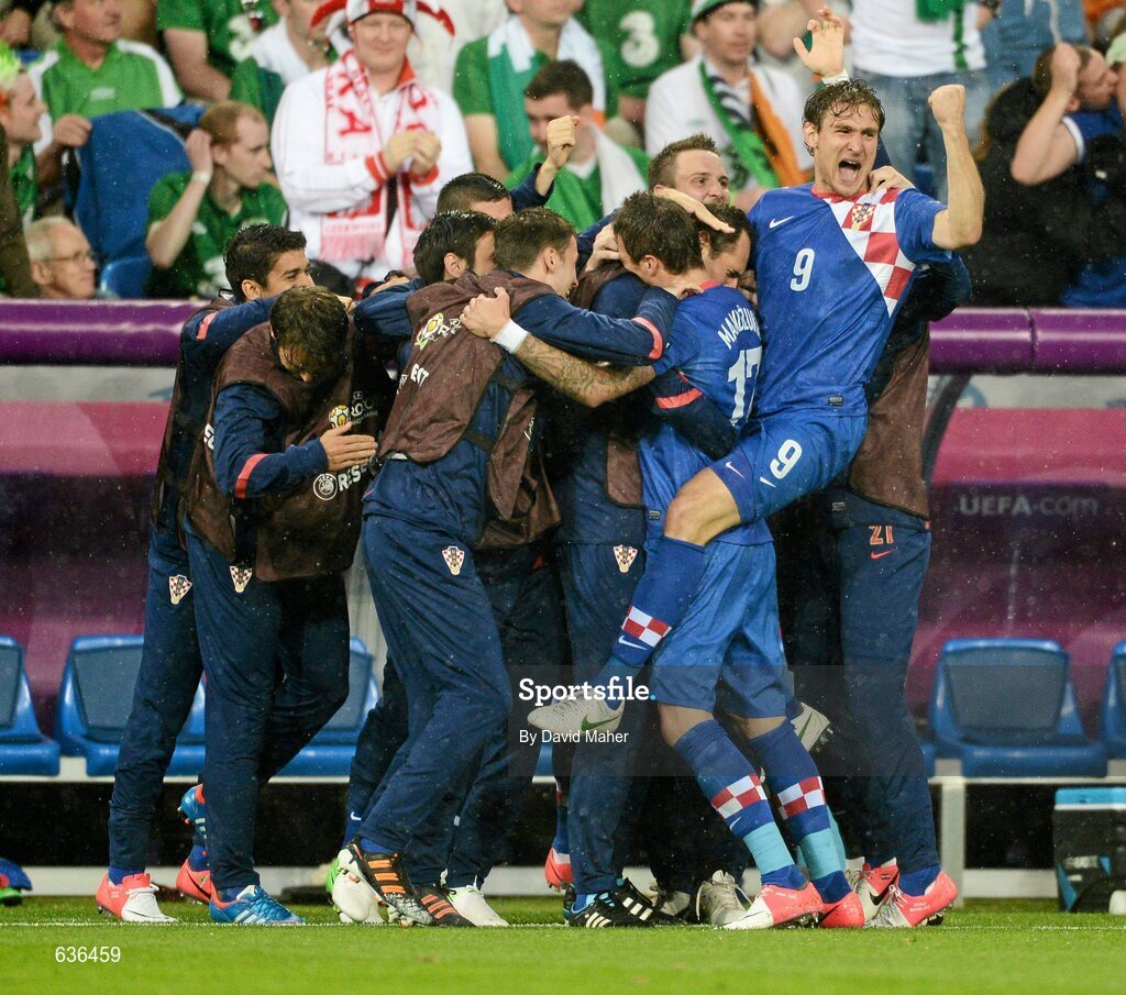 10 June 2012; Croatia players and management including Nikica Jelavic and goalscorer Mario Mandžukic celebrate their side's first goal. EURO2012, Group C, Republic of Ireland v Croatia, Municipal Stadium Poznan, Poznan, Poland. Picture credit: David Maher / SPORTSFILE