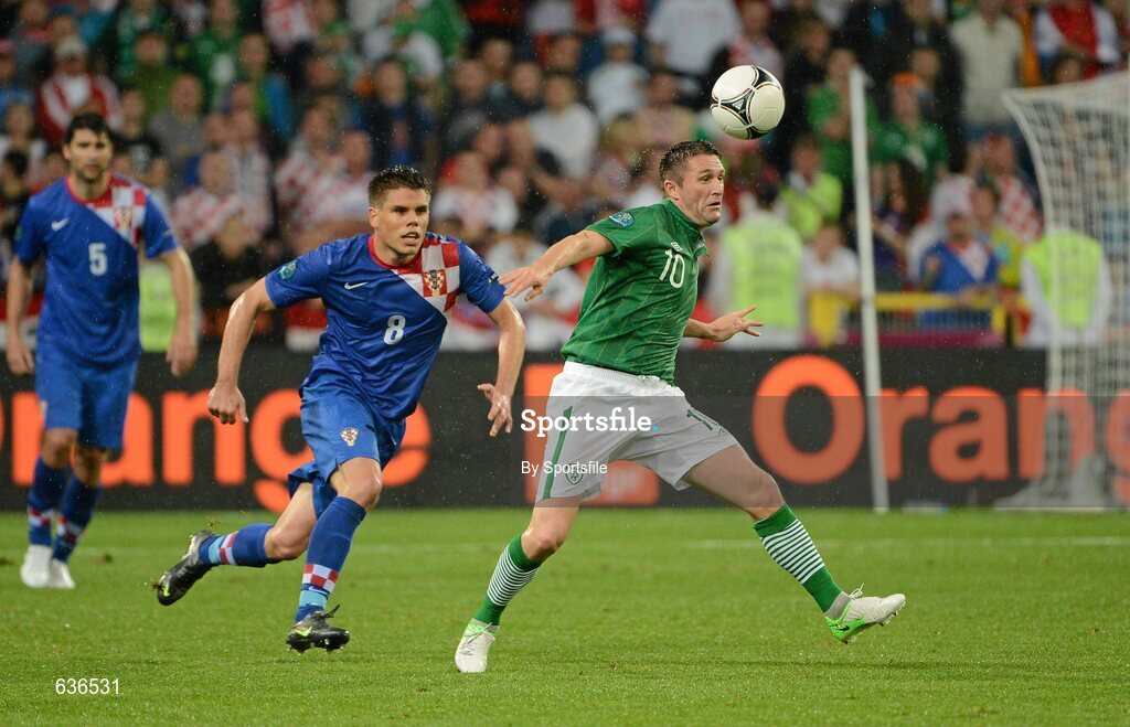 10 June 2012; Robbie Keane, Republic of Ireland, in action against Ognjen Vukojevic, Croatia. EURO2012, Group C, Republic of Ireland v Croatia, Municipal Stadium Poznan, Poznan, Poland. Photo by Sportsfile