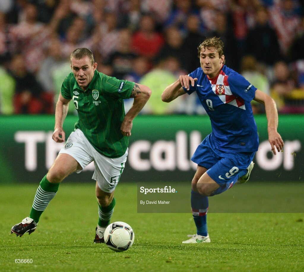 10 June 2012; Richard Dunne, Republic of Ireland, in action against Nikica Jelavic, Croatia. EURO2012, Group C, Republic of Ireland v Croatia, Municipal Stadium Poznan, Poznan, Poland. Picture credit: David Maher / SPORTSFILE