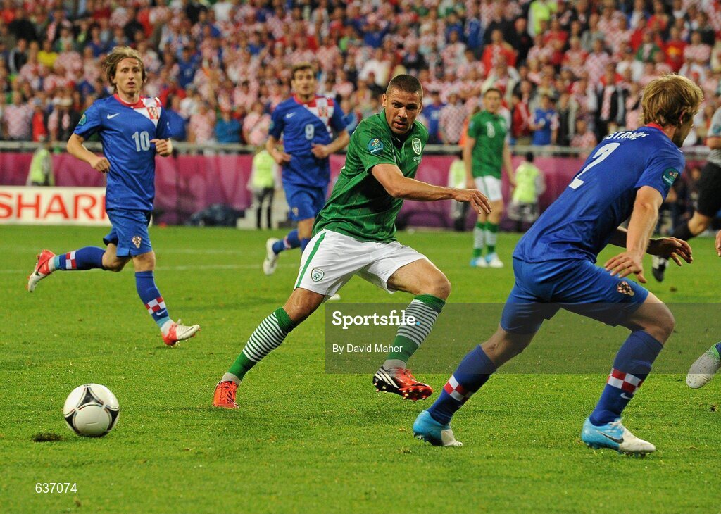 10 June 2012; Jonathan Walters, Republic of Ireland, in action against Ivan Stinic, right, and Luka Modric, Croatia. EURO2012, Group C, Republic of Ireland v Croatia, Municipal Stadium Poznan, Poznan, Poland. Picture credit: David Maher / SPORTSFILE